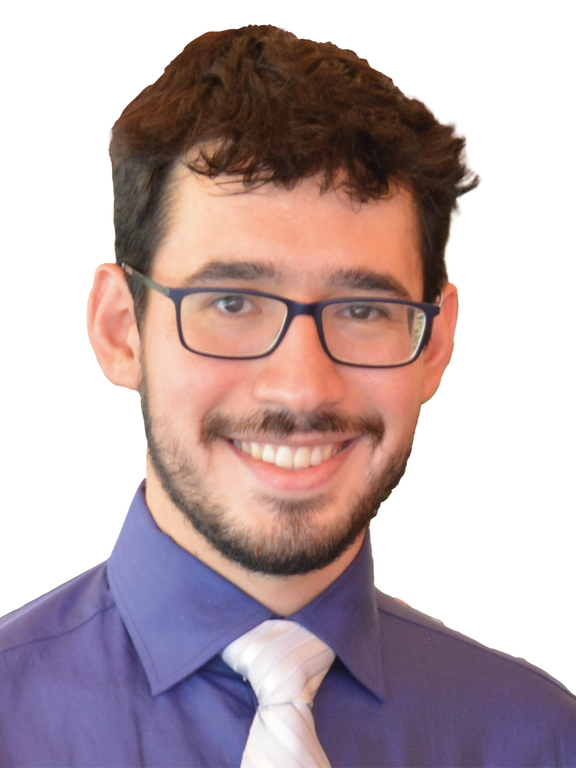 Man, white, brown hair, short and straight, wearing glasses with black rectangular frame, blue shirt, and white tie