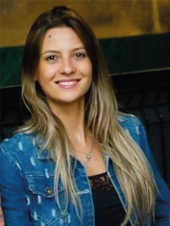 Woman, white, blond, log and straight hair, wearing black blouse with denim jacket