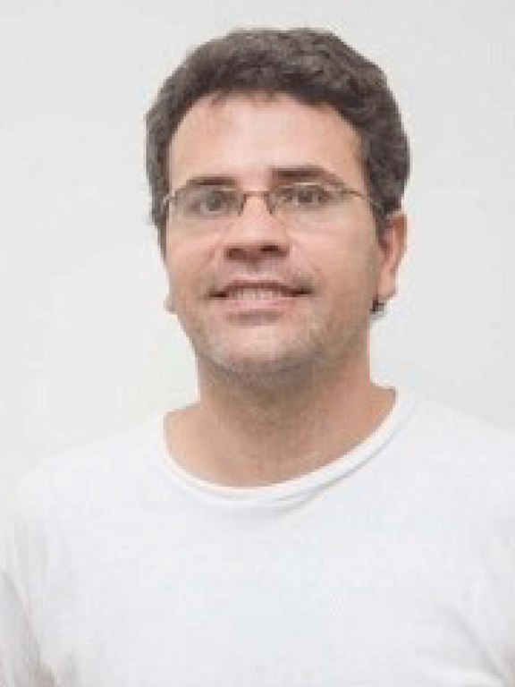 Man wearing glasses and white t-shirt